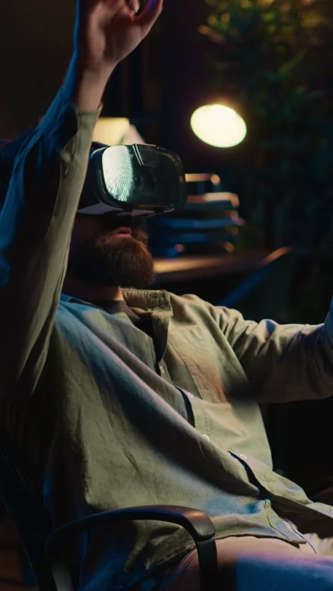 Vertical video Man using VR headset to do programming scared after AI becoming Stock Footage 266749479