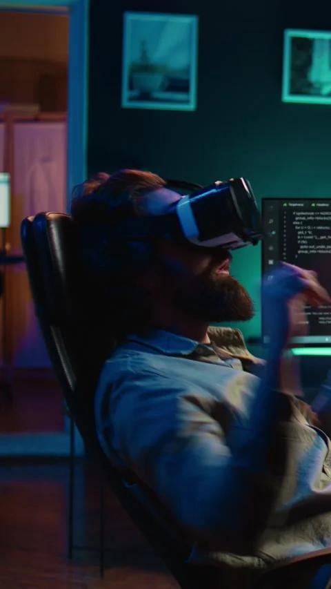 Vertical video Man using VR headset to do programming scared after AI becoming Stock Footage 267163119