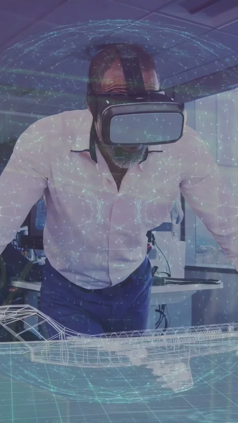 Vertical video: Man with VR headset activating plane holo and grid over desk for Stock Footage 332335491