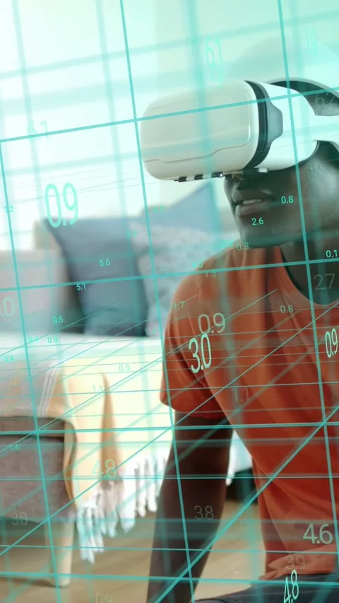 Vertical video: Man with VR headset testing tech app, headset activating teal Stock Footage 334024860