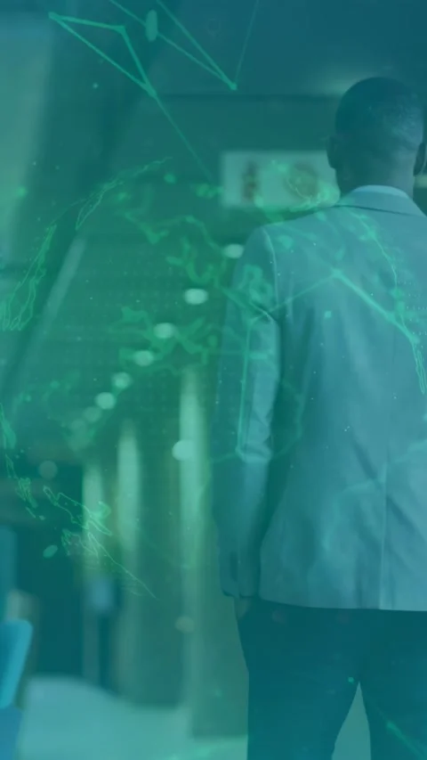 Vertical video: Man walking down business corridor after pause, green globe Stock Footage 335513917