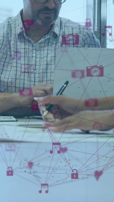 Vertical video: Man watching pen entering taking notes for review, pink icons Stock Footage 333236021