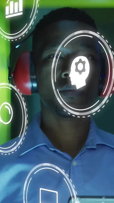 Vertical video: Man wearing earmuffs on phone hold in testing HUD icons rotating Stock Footage 331738796
