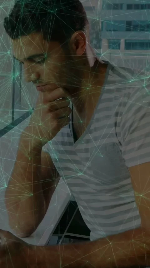 Vertical video: Man at window tapping phone, causing teal web overlay and Stock Footage 331338006