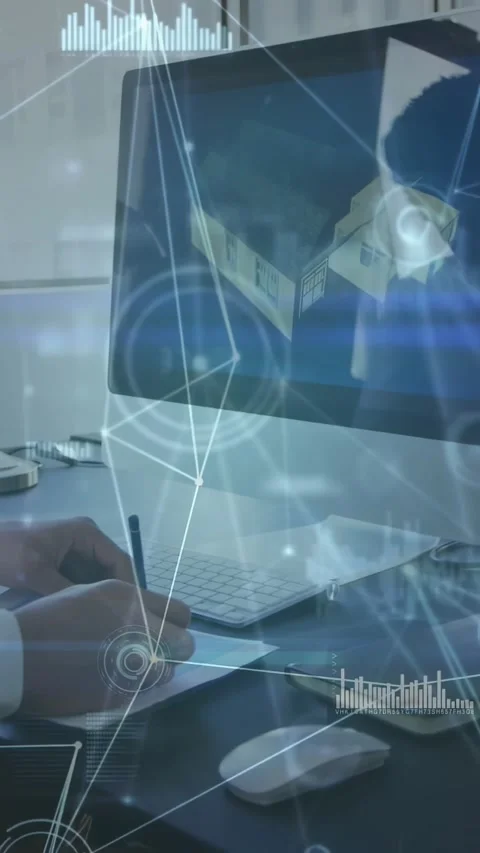 Vertical video: Man writing and using mouse at desk activating HUD and analyzing Stock Footage 331199088