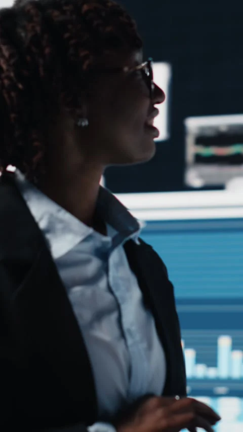 Vertical video Manager evaluating business market graphs using laptop software Stock Footage 318684971