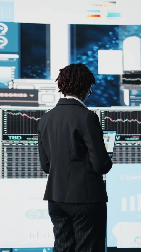 Vertical video Manager evaluating business market graphs using laptop software Stock Footage 318687008
