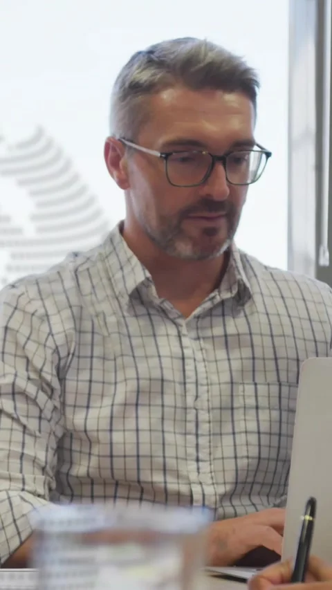 Vertical video: Manager scanning document from colleague tapping laptop Stock Footage 330965772