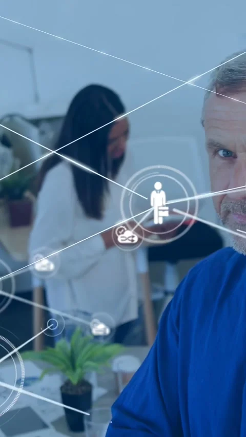 Vertical video: Manager smiling as HUD popping and showing tech network while Stock Footage 334544407