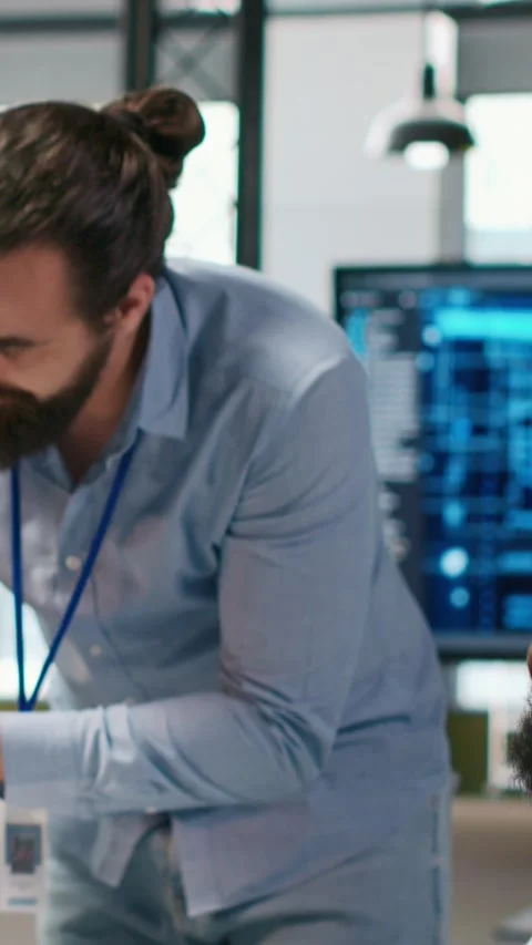 Vertical video Manager supervising developer with paraplegia writing deep Stock Footage 312708645