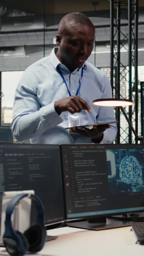 Vertical video Manager talking with engineer in office automating workflows Stock Footage 322696178