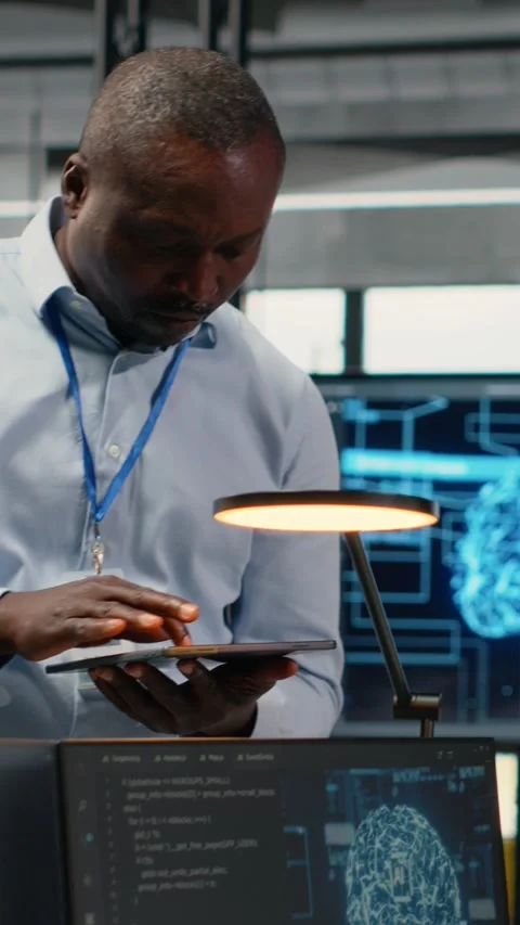 Vertical video Manager talking with intern in office, using AI specialized Stock Footage 322696032