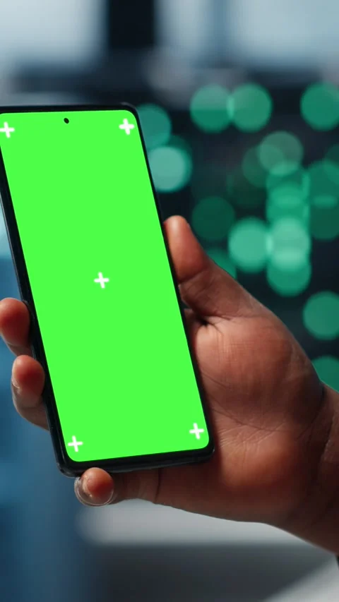 Vertical video Manager using app on chroma key phone to check server farm energy Stock Footage 316860327