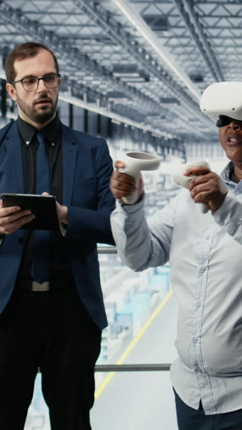 Vertical video Managers in microchip smart factory using VR glasses gear to Stock Footage 333614237