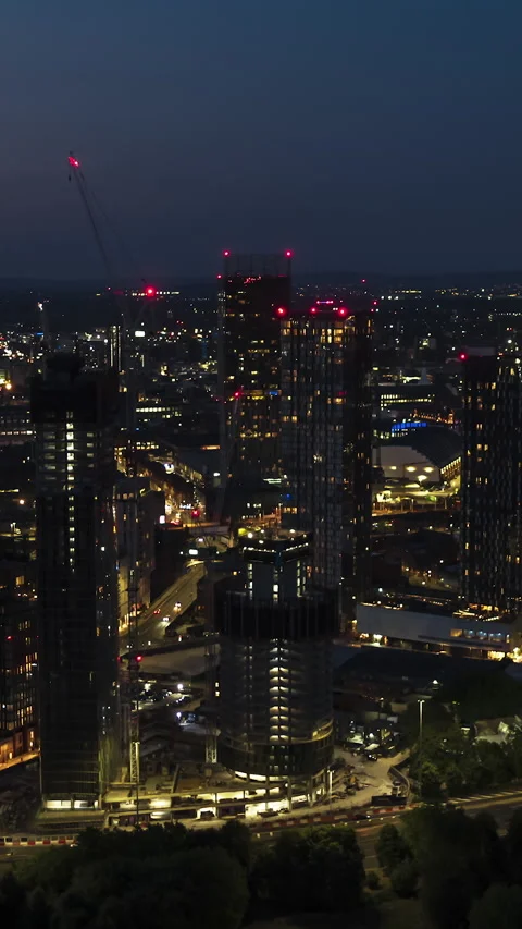 Vertical Video of Manchester, Vertical Aerial View Shot, night, evening Stock Footage 270831953