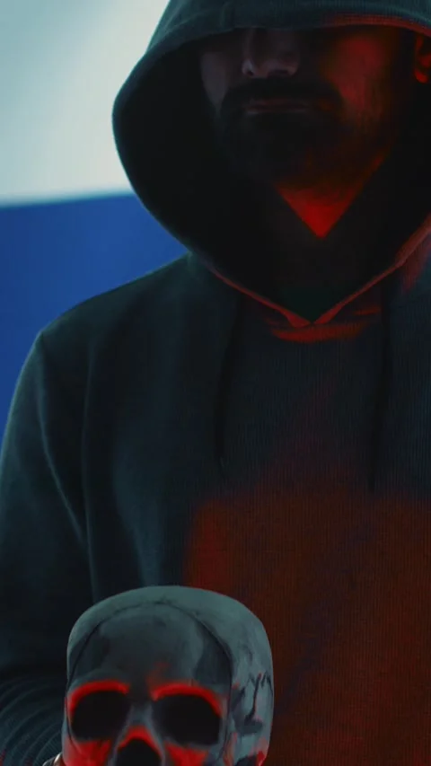 Vertical Video A maniacal russian hacker creating cyber threat alert by holding Stock Footage 277855004