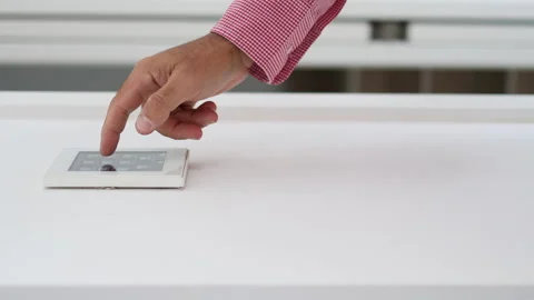 Vertical video of man's hand adjusting the temperature on home automation screen Stock Footage 220033435
