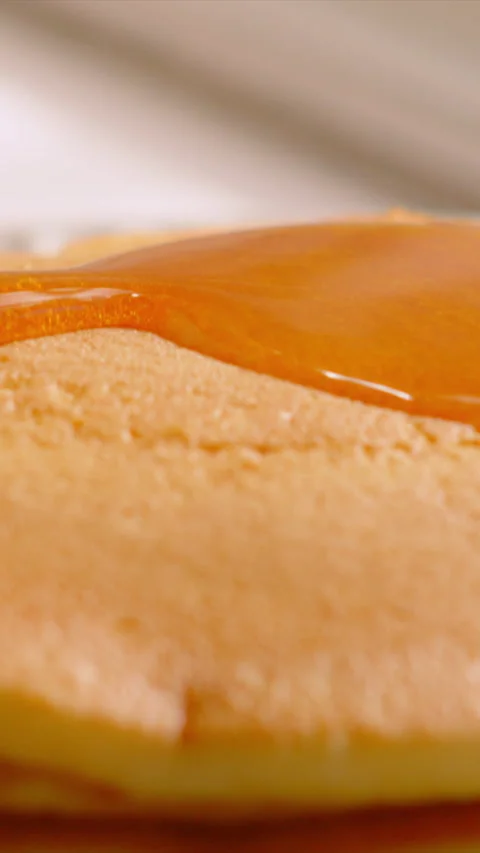Vertical Video of Maple Syrup being Poured on Stack of Buttermilk American Stock Footage 340841872