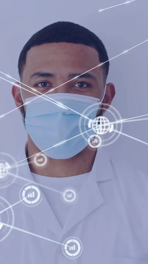 Vertical video: Masked Dr facing camera, HUD appearing and mapping clinical data Stock Footage 332277946