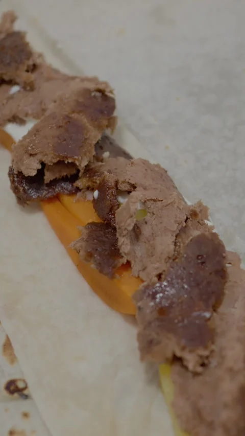Vertical video Masterful hands create a flavorful kebab with fresh toppings on Stock Footage 329626324