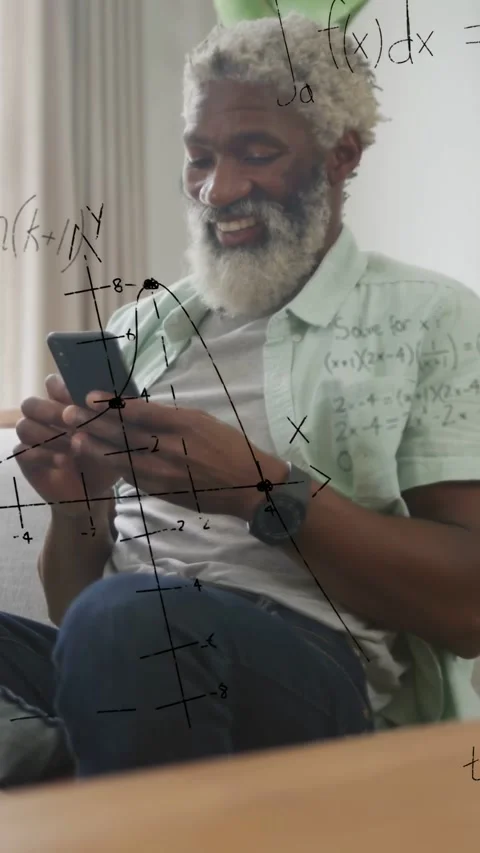 Vertical video: Mature man on couch tapping phone and causing math overlay Stock Footage 335513496