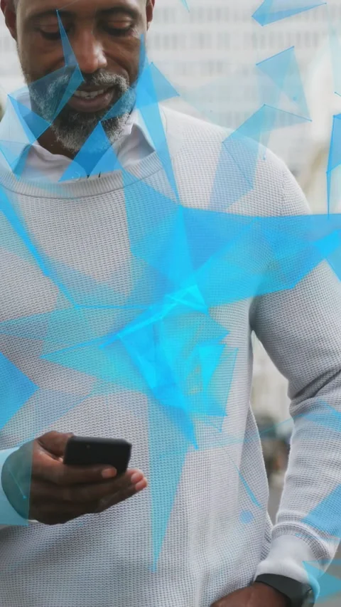 Vertical video: Mature man tapping phone starting audio for IT as blue triangles Stock Footage 333720975