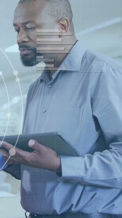 Vertical video: Mature manager taking tablet from blue arm and reviewing tech Stock Footage 333861851