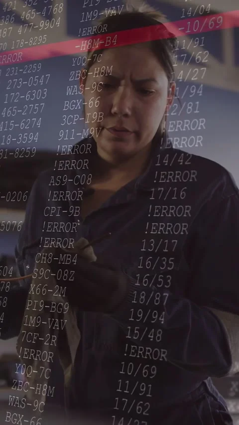 Vertical video: Mechanic while inspecting clip in garage, overlay with ERROR Stock Footage 334598684