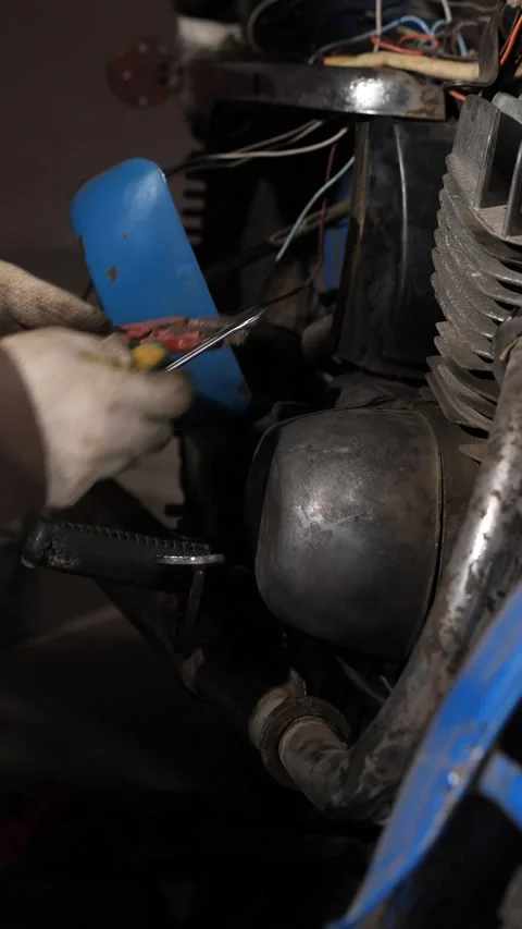 Vertical video mechanic's gloved hands using a wrench to tightly grip and Stock Footage 342767680
