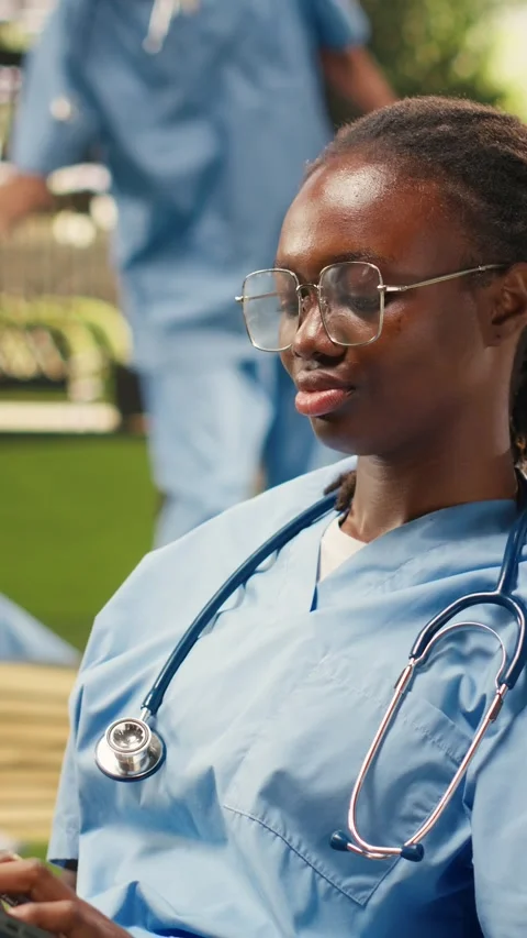 Vertical Video Medical student does independent study on laptop while reclining Stock Footage 341320974