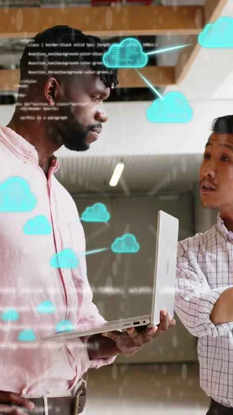 Vertical video: Men holding laptop, teal clouds and code appearing, peer Stockbeeldmateriaal 333487477