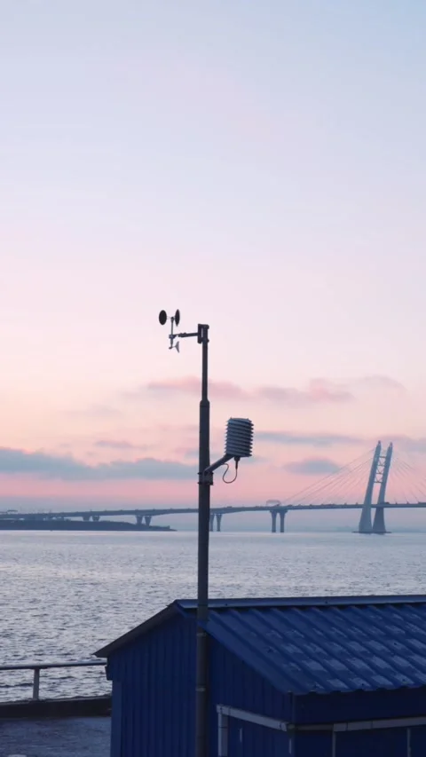 Vertical video with meteorological station measures evening's approach, bridge Stock Footage 271297787
