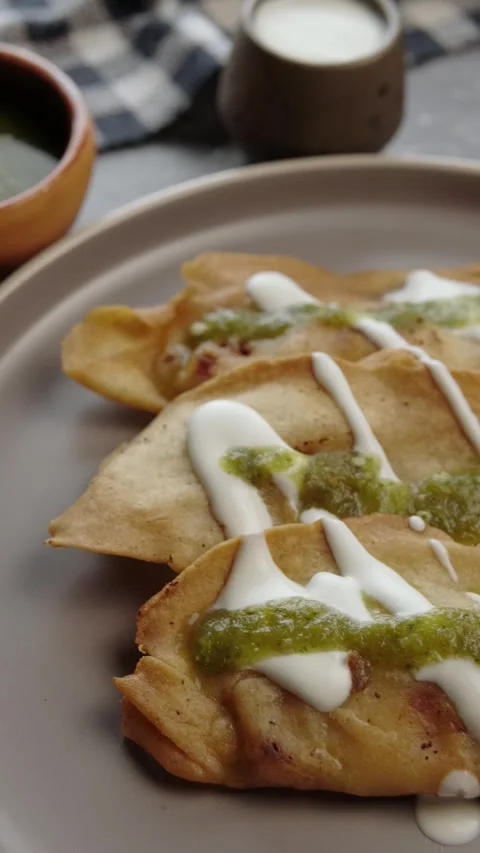 Vertical video, Mexican molotes served on a restaurant Stock Footage 282422740
