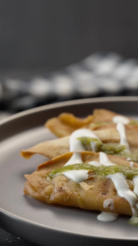 Vertical video, Mexican molotes served with sour cream dripping down Stock Footage 282422742