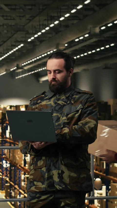 Vertical Video Military personnel working with staff in a warehouse security Stock Footage 330202953