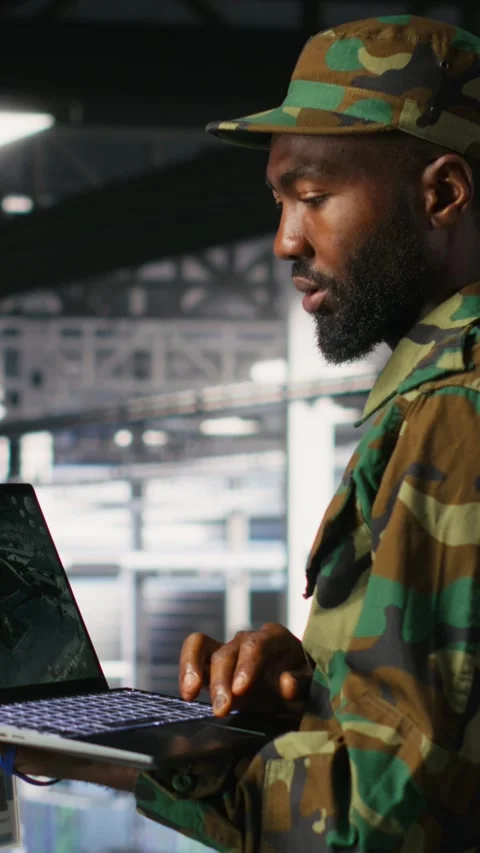 Vertical video Military technician in data center monitoring warfare drone Stock Footage 310773603