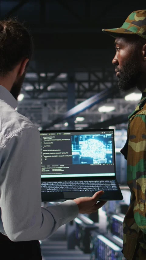 Vertical video Military technicians in secure data center use laptop to monitor Stock Footage 310779507