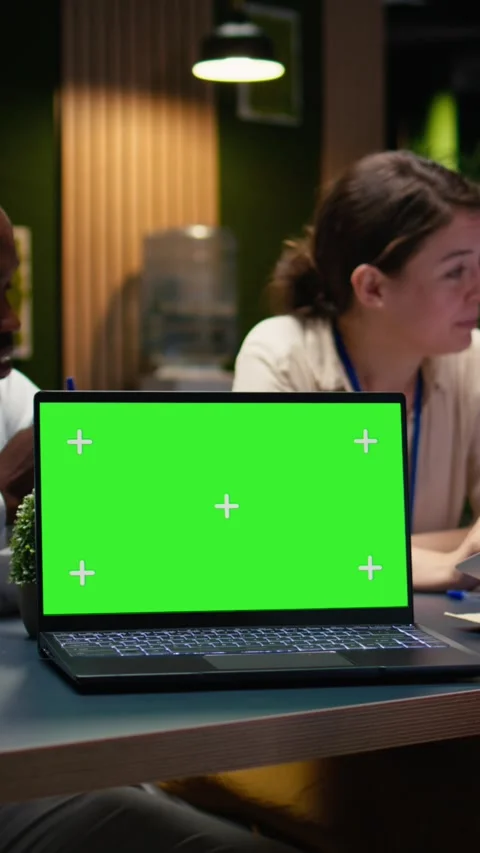 Vertical Video Mockup chroma key laptop used by office employees doing business Stock Footage 334104442