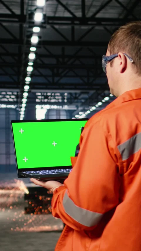 Vertical Video Mockup screen laptop with supervisor oversees construction and Stock Footage 321844158