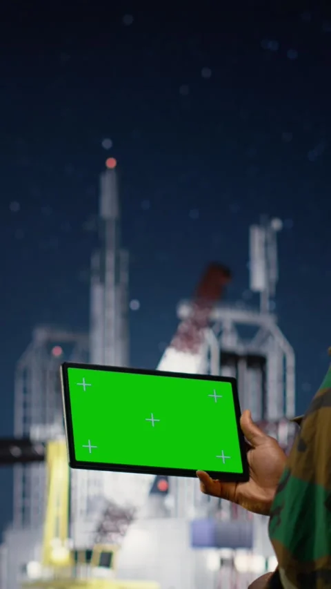 Vertical video Mockup tablet and walkie talkie used by military man on drilling Stock Footage 339890900
