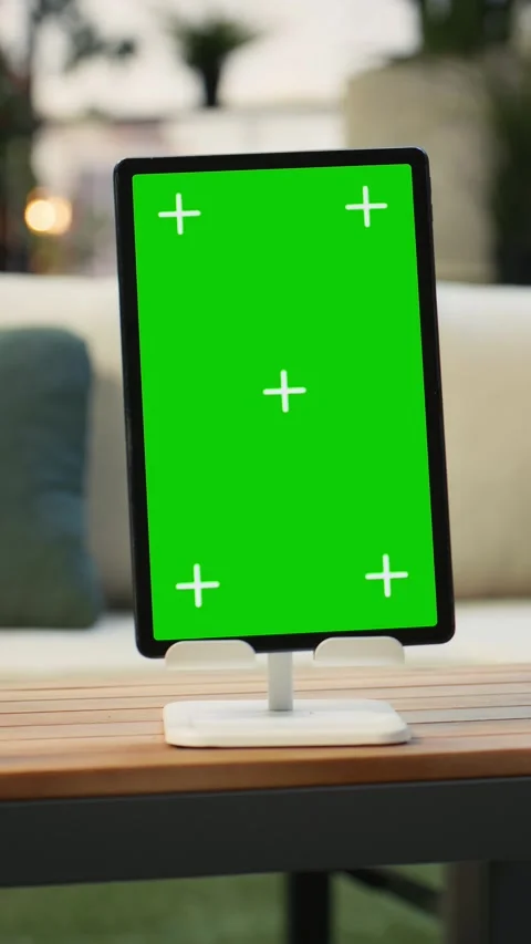 Vertical video Mockup tablet with isolated screen next to potted plant on wooden Stock Footage 345166196
