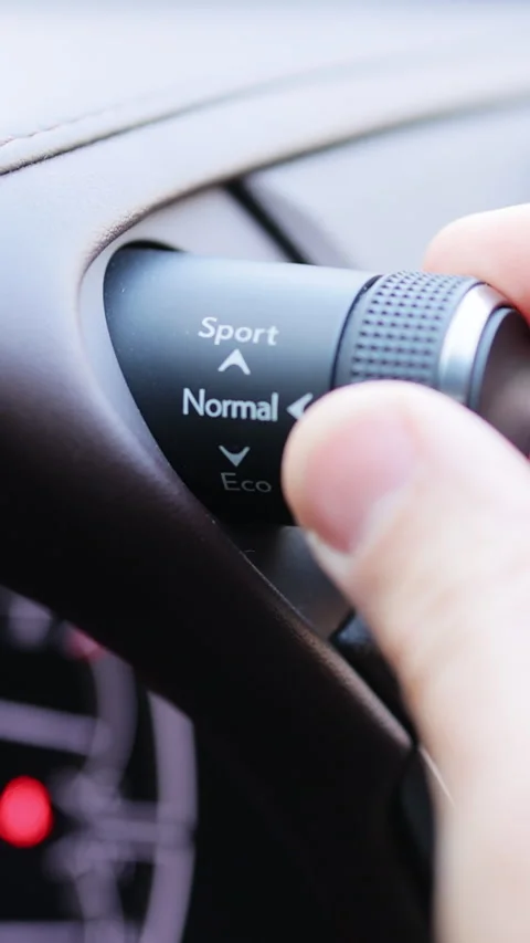 Vertical Video of Mode button on luxury car dashboard. Eco mode is a relaxed and Stock Footage 306763725