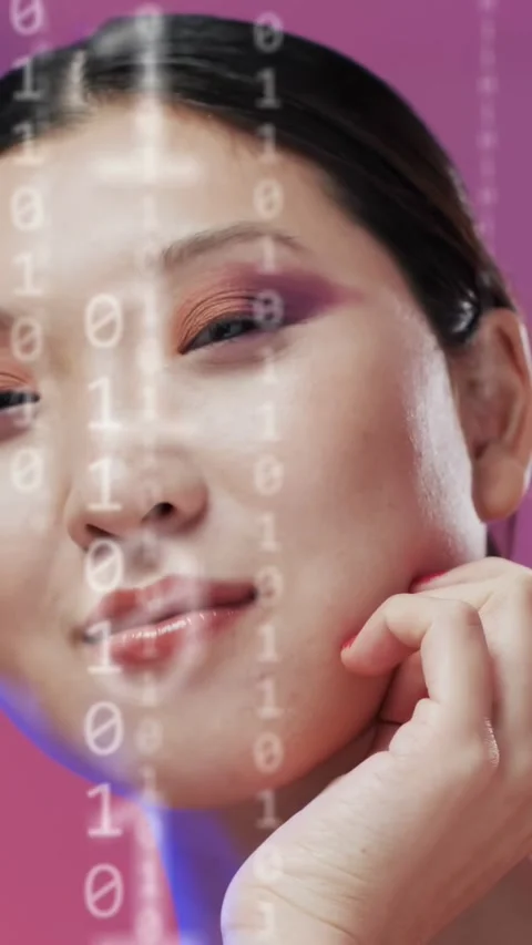Vertical video: Model holding jaw as binary digits fading in, HUD nodes moving Stock Footage 333895925