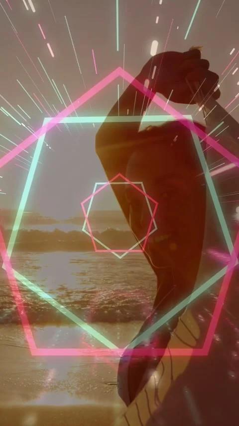 Vertical video: Model posing on shore at sunset, neon overlay appearing over Stock Footage 332644652
