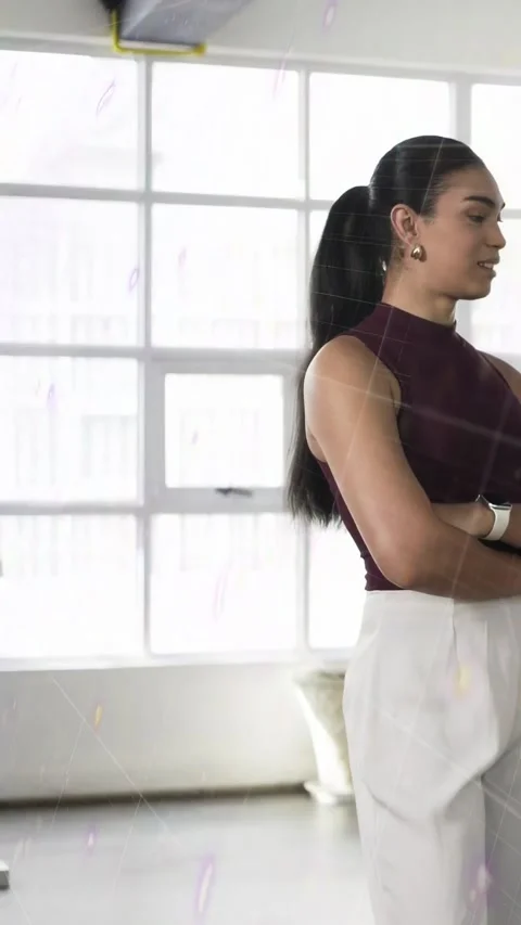 Vertical video: Model standing by grid window, graphics sweeping in revealing Stock Footage 333465462