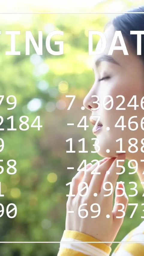 Vertical video: Model touching chin, smiling on camera cue, data overlay framing Stock Footage 333496273