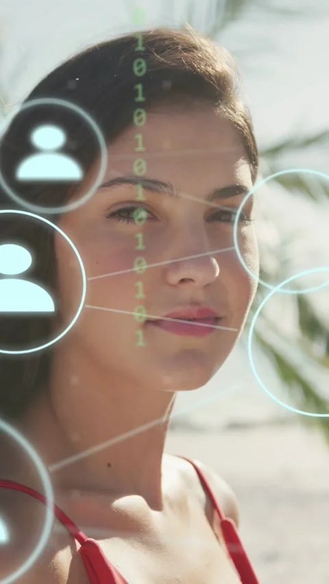 Vertical video: Model turning to camera at beach, ear circle activating tech Stock Footage 340133559
