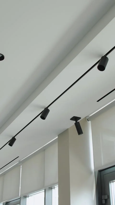 Vertical video. Modern Ceiling Track Lighting Features in a Beautifully Designed Stock Footage 303858192