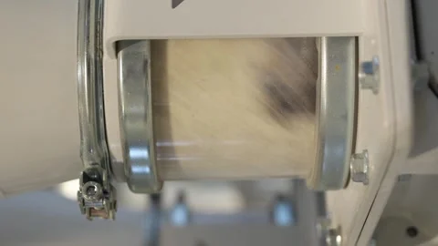 Vertical video. Modern flour mill. Close up of wheat milling moving through the Video stock 277952268