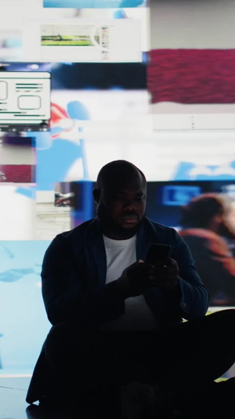Vertical Video Modern guy holding his phone expressing harmful effects of social Video stock 312177068